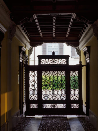 Entryway of historic residential building along Via Carlo Alberto in Monza, Brianza, Lombardy, Italyの写真素材