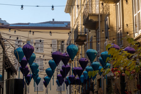 Residential buildings along via Paolo Sarpi in Milan, Lombardy, Italy, with blue lanternsの写真素材