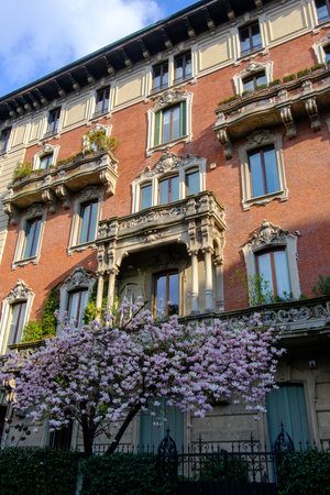 Exterior of old residential building along via Rovani in Milan, Lombardy, Italyの写真素材