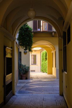 Historic buildings along via Ambrosiana in Milan, Lombardy, Italy