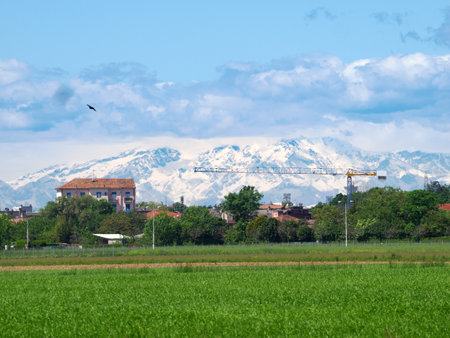 Old house against Monte Rosa in background at Cinisello Balsamo, Milan, Lombardy, Italyの写真素材