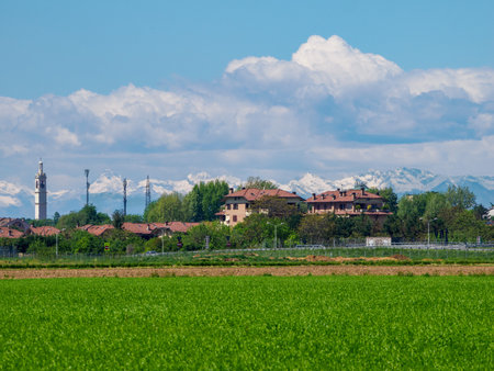 Buildings against mountain range in background at Cinisello Balsamo, Milan, Lombardy, Italyの写真素材