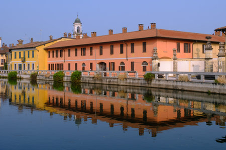 Gaggiano, historic town along the Naviglio Grande, Milan, Lombardy, Italy, with colorful houses along the canalの写真素材