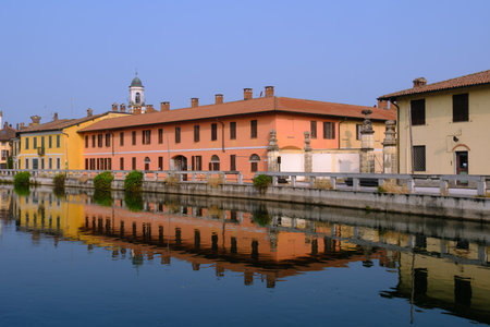 Gaggiano, historic town along the Naviglio Grande, Milan, Lombardy, Italy, with colofrul houses along the canalの写真素材