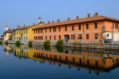 Gaggiano, historic town along the Naviglio Grande, Milan, Lombardy, Italy, with colofrul houses along the canalの写真素材