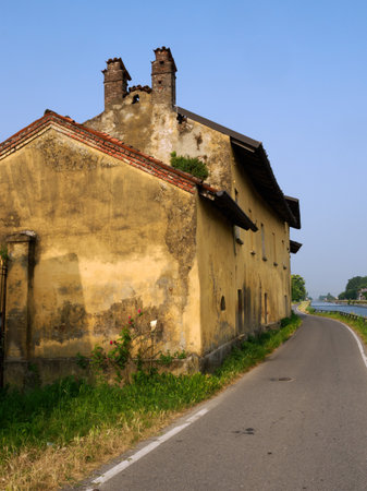 Cycle path along the Naviglio Grande near Gaggiano, Milan, Lombardy, Italy, in Juneの写真素材