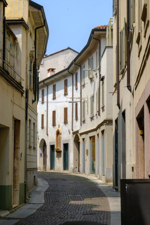 Historic buildings along Via del Popolo in Vigevano, Pavia, Lombardy, Italyの写真素材