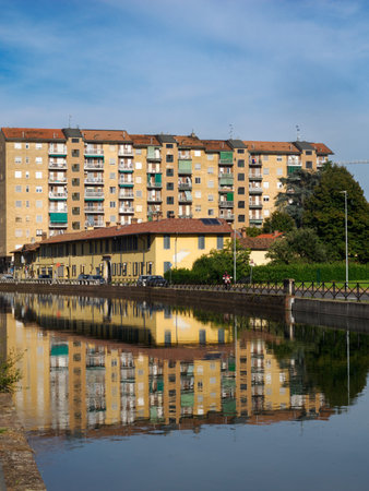 Trezzano sul Naviglio, Milan, Lombardy, Italy: buildings reflected in the Naviglio Grandeの写真素材