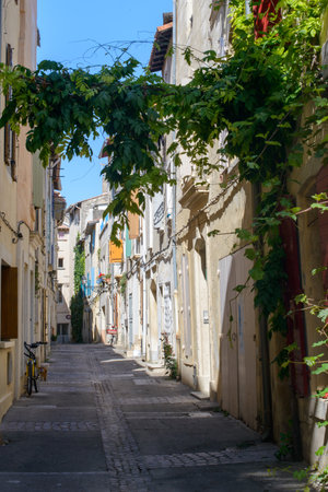 Arles (Bouches-du-Rhone, Provence-Alpes-Cote-d'Azur): a typical old streetの写真素材