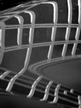 Modern residential building along via Faravelli in Milan, Lombardy, Italy, reflected on a carの写真素材