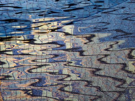 Reflections in the water of Piazza Gae Aulenti in Milan, Lombardy, Italyの写真素材