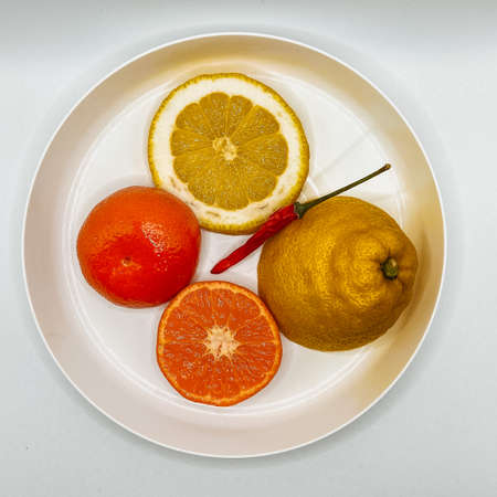 Still life: Lemon, tangerine and bitter pepperの写真素材