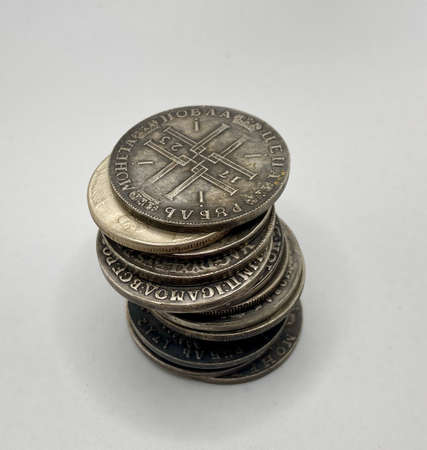 A few old silver coins in a pile