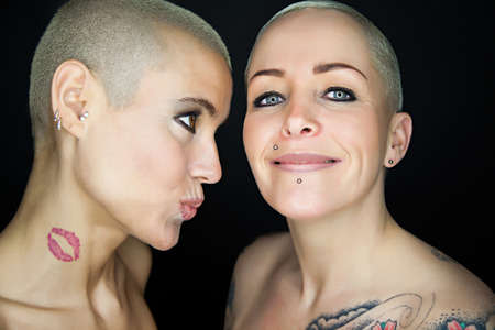 crazy beautiful women kissing の写真素材