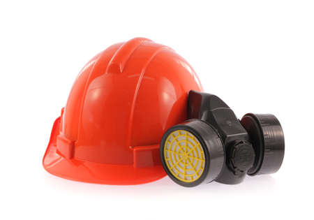 Orange safety helmet and chemical protective mask isolated on white backgroundの写真素材