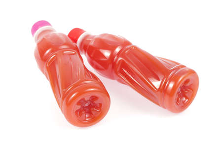 bottled fruit juice isolated on white backgroundの写真素材