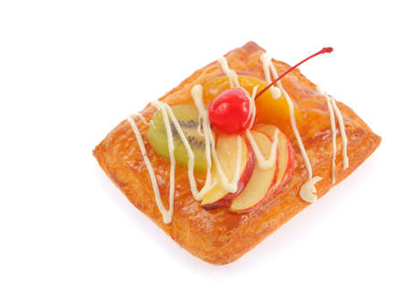 Delicious puff pastry with cream and fruits isolated on white backgroundの写真素材