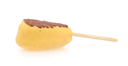 Heart souffle bread piece covered with chocolate on wooden stick isolated on a white backgroundの写真素材