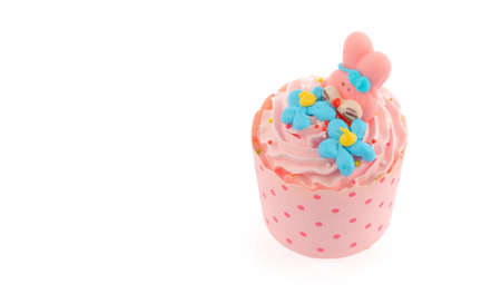 Cupcake with butter cream icing isolated on white の写真素材