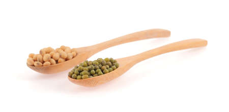 Mung Beans and soybean in wooden spoon isolated on white の写真素材
