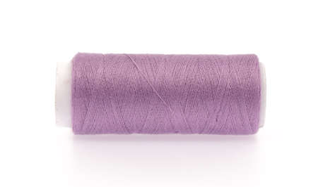 Spools of colours threads isolated on white background