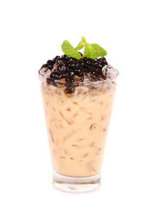 Iced milk tea isolated on white backgroundの写真素材
