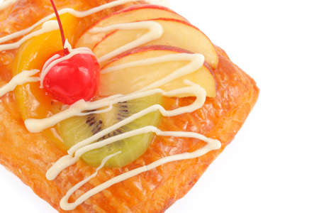 Delicious puff pastry with cream and fruits isolated on white backgroundの写真素材