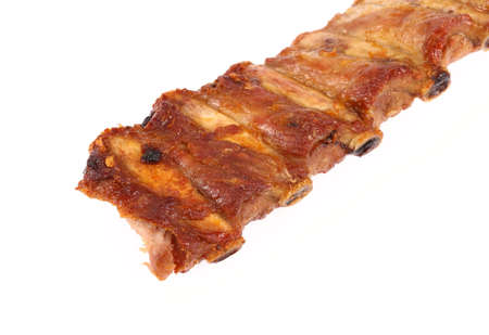 juicy barbecued pork ribs on a white backgroundの写真素材