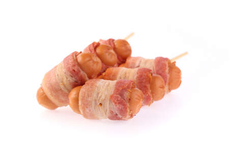 sausages wrapped in bacon, isolated on white backgroundの写真素材