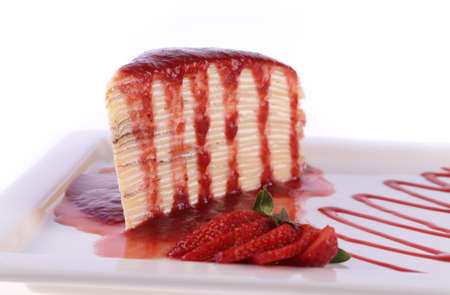 Strawberry cake in dish isolated on white backgroundの写真素材