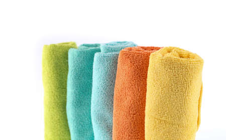 Colorful towels rolls isolated on white background.