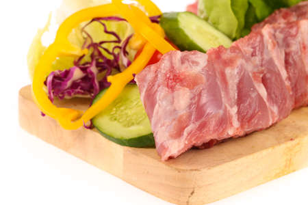 pork ribs on cutting board with vegetableの写真素材