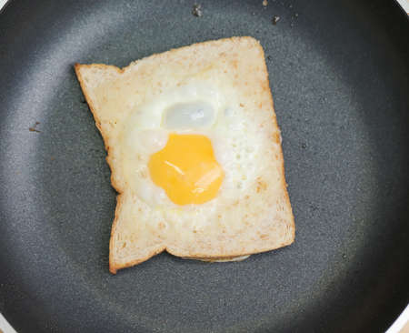 Image of egg in hole toastの写真素材