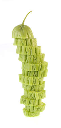 slices of bitter gourd isolated on a white backgroundの写真素材