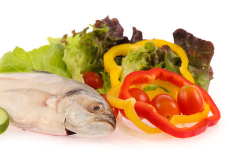 Fresh mackerel fish with vegetables isolated on white backgroundの写真素材