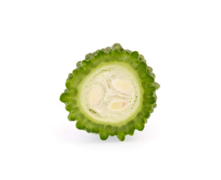 slice of balsam pear bitter melon isolated on white backgroundの写真素材