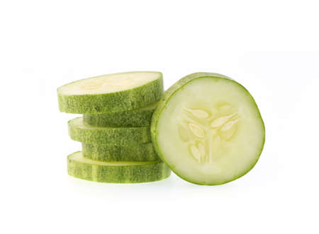 sliced fresh cucumber isolated on white backgroundの写真素材