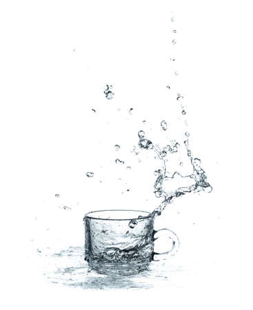 Water splashing from glass isolated on white backgroundの写真素材