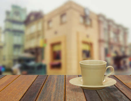 Cup of Coffee on the balcony with modern city view