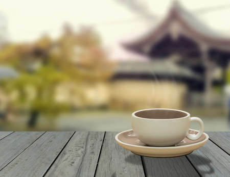 warm cup of coffee on wooden tableの写真素材