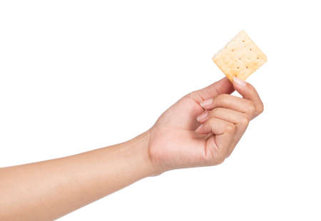 hand holding biscuits isolated on white backgroundの写真素材