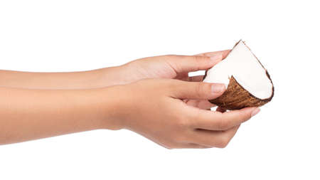 hand holding Coconut Old brown isolated on white backgroundの写真素材