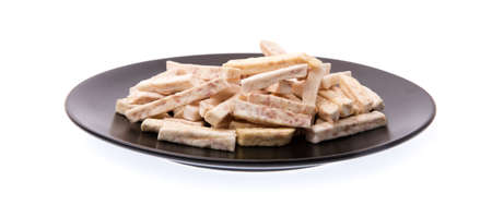 taro snacks on dish isolated on white background.の写真素材