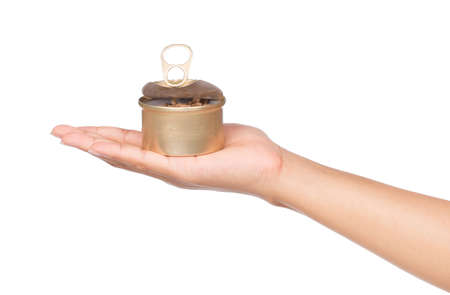 hand holding canned tuna isolated on white backgroundの写真素材