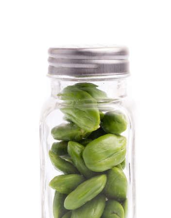 bottle of Parkia speciosa seeds isolated on white backgroundの写真素材