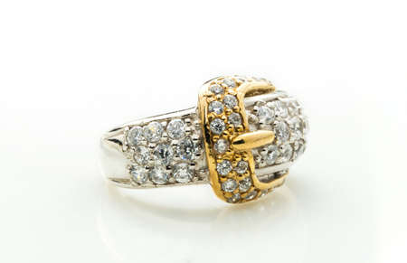 classic ring with a yellow topaz stone on white backgroundの写真素材