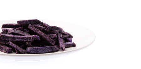 dish of fried taro chips, Taro snacks isolated on white backgroundの写真素材