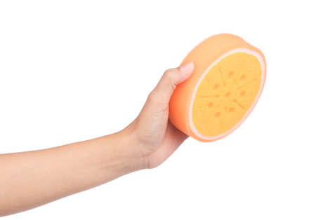 hand holding Orange sponge isolated on white background.の写真素材