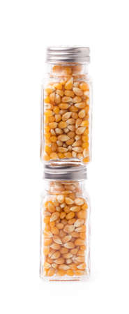 bottle of corn seeds isolated on white background