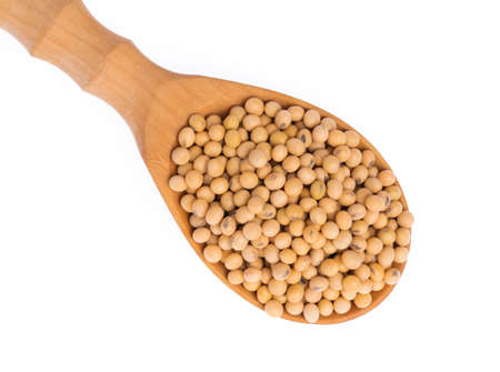 wood ladle of soybeans isolated on white backgroundの写真素材